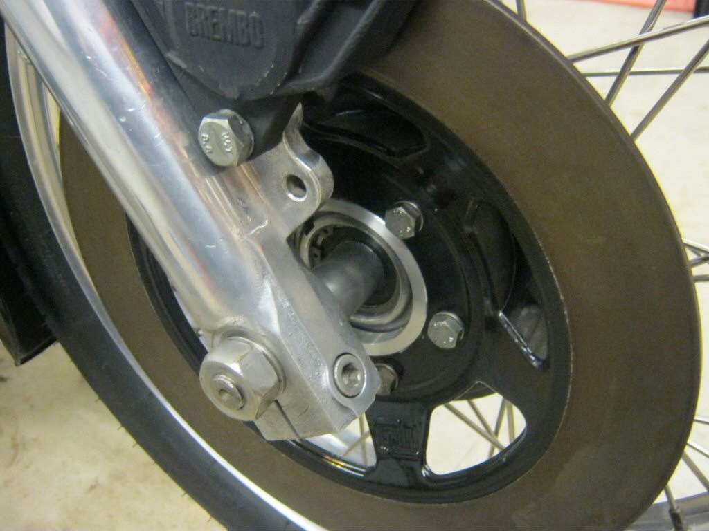 Disc brake spacer as used to fit a disc brake to drum brake Moto Guzzi V700, V7 Special, Ambassador, 850 GT, 850 GT California, Eldorado, and 850 California Police motorcycles.Spacer made by Steve Odell.