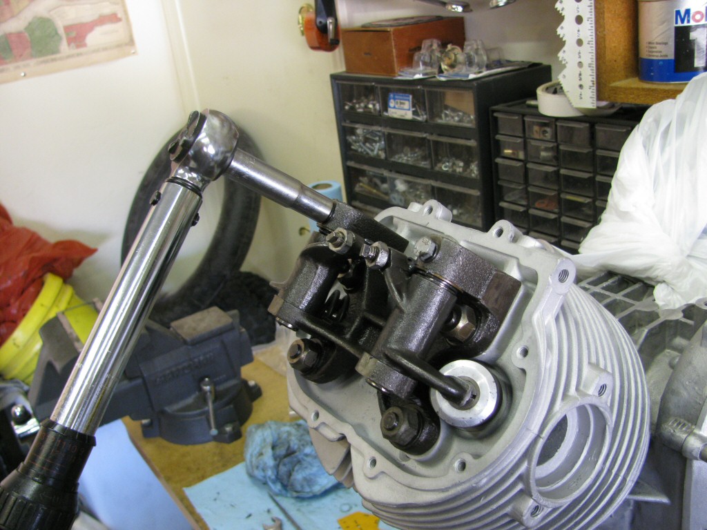 The exhaust valve components in place, torqueing the bolts that secure the rocker arm in place.