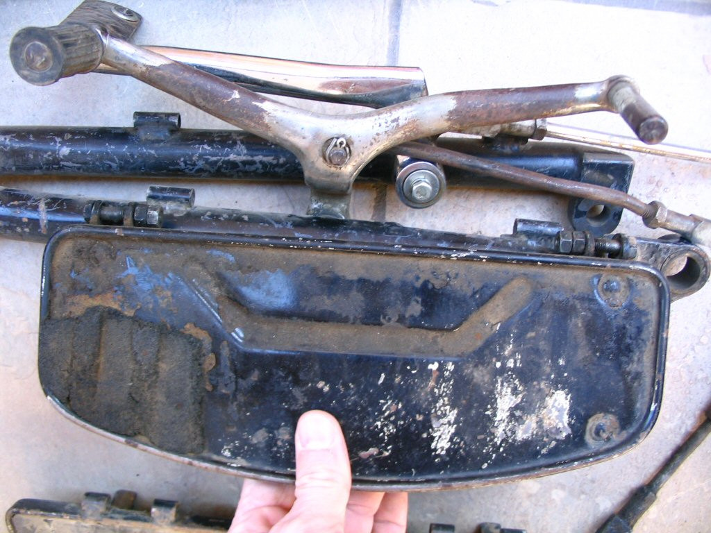 A later footboard held up to the earlier rail. Notice that mounts are not even close to being in the same position.