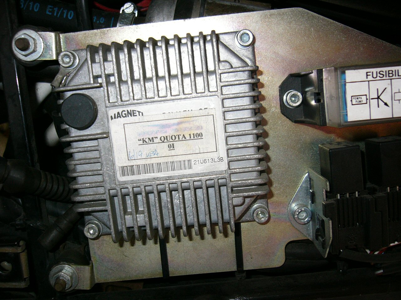 Moto Guzzi Quota ECU with an updated sticker.