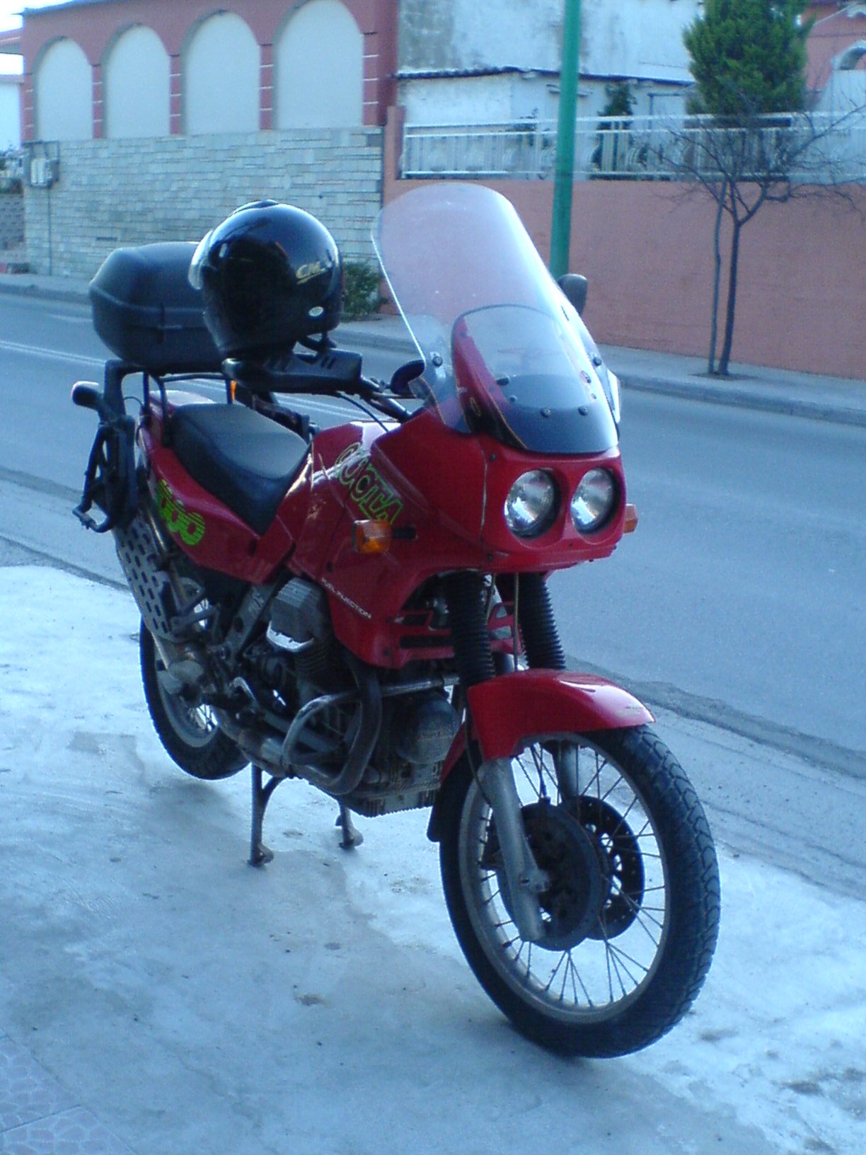 Kymco 500 scooter windshield fitted to a Moto Guzzi Quota 1000.