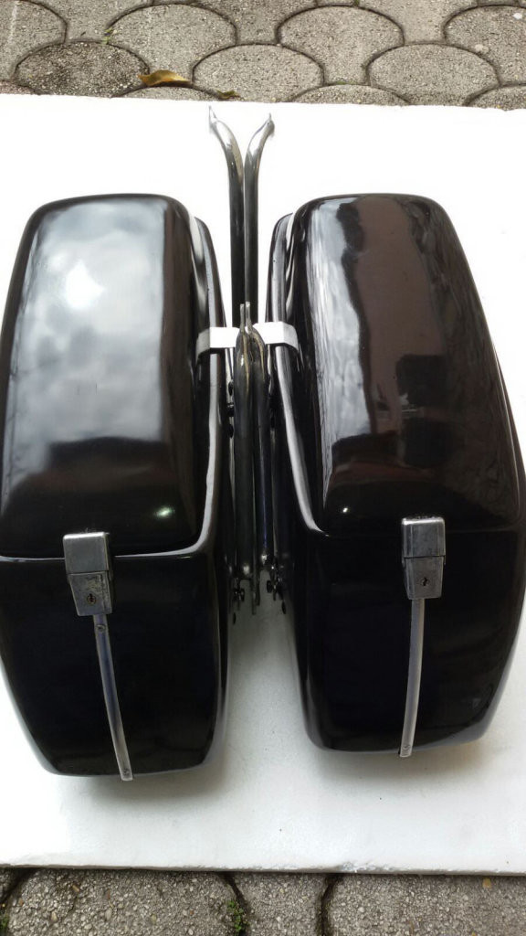 Original Moto Guzzi saddlebags that have had the handles removed from the lid (smaller).