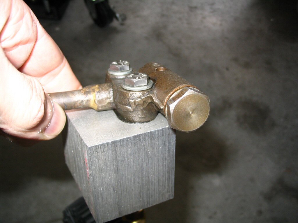 Pressure tester for an oil pressure relief valve.