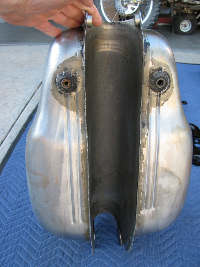 Gas tank stripped of paint. Underside looks good.